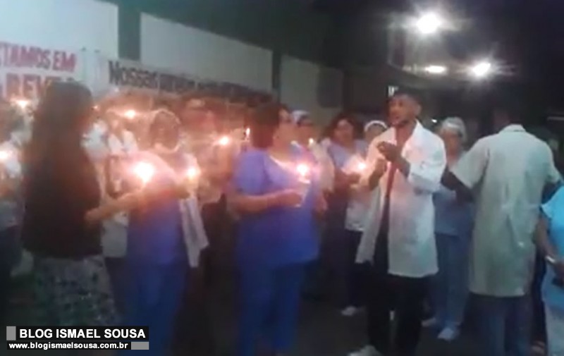 Servidores da saÃºde em greve acendem velas na esperanÃ§a de receberem salÃ¡rios